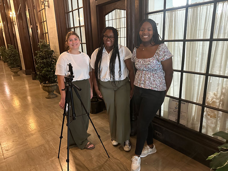 Authors Bryanna Cole, Elgin High School, and Jasmine Fox, Bartlett High School visit with Stephanie Asare, intern for Representative Anna Moeller's Office.