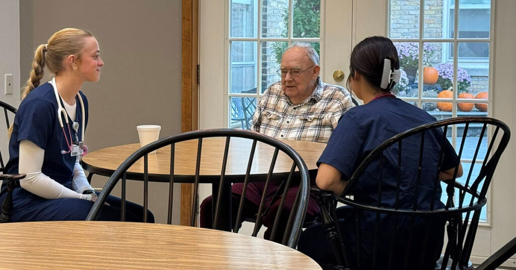 District 301 interns visit a resident at the Atirum Oak Crest