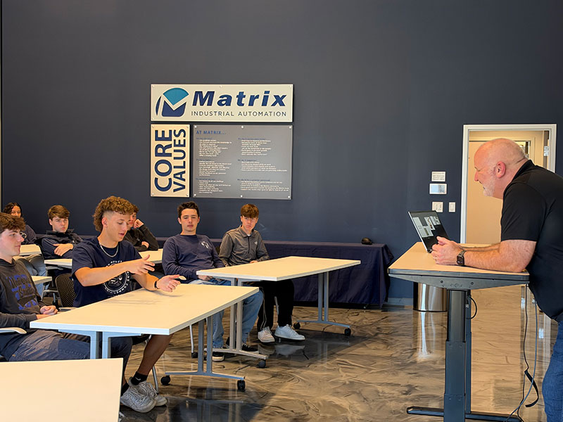 Students ask questions while touring Matrix